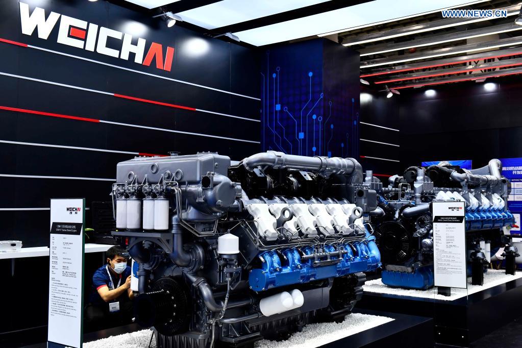 Photo taken on April 21, 2021 shows engines presented by Weichai Power Co., Ltd. at the 2nd World Congress on Internal Combustion Engines in Jinan, east China's Shandong Province. The technology of producing high-end diesel engine used to be a bottleneck for China's equipment manufacturing industry. Weichai Power Co., Ltd., a state-owned enterprise founded in 1946, has developed China's first high-speed and high-power engine with completely independent intellectual property rights after more than ten years of scientific and technological research, completely ending China's long-term reliance on foreign technologies for heavy commercial vehicles. In 2018, Weichai won the first prize of the State Scientific and Technological Progress Award, and embarked on a path towards international market and high-quality development. (Xinhua/Guo Xulei)
