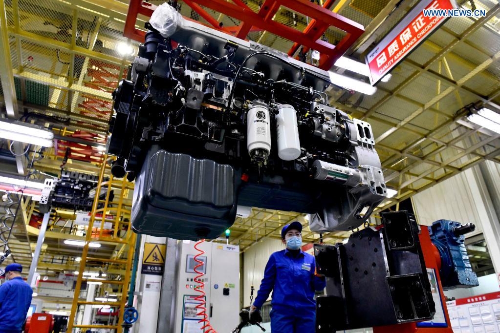 Workers assemble engines on an assembly line at a workshop of the Weichai Power Co., Ltd. in Weifang City, east China's Shandong province, April 22, 2021. The technology of producing high-end diesel engine used to be a bottleneck for China's equipment manufacturing industry. Weichai Power Co., Ltd., a state-owned enterprise founded in 1946, has developed China's first high-speed and high-power engine with completely independent intellectual property rights after more than ten years of scientific and technological research, completely ending China's long-term reliance on foreign technologies for heavy commercial vehicles. In 2018, Weichai won the first prize of the State Scientific and Technological Progress Award, and embarked on a path towards international market and high-quality development. (Xinhua/Guo Xulei)