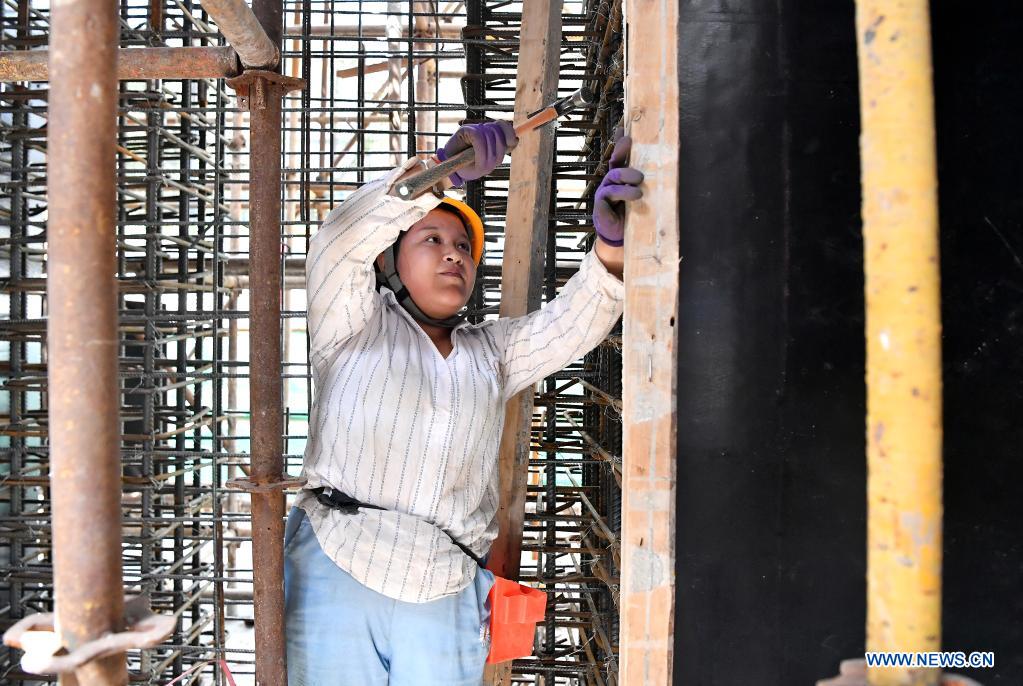 A worker from China Railway Seventh Group Co., Ltd. works at the construction site of a project in Weiyang District of Xi'an City, capital of northwest China's Shaanxi Province, May 1, 2021. People from various sectors stick to their posts during the Labor Day holiday. (Xinhua/Liu Xiao)