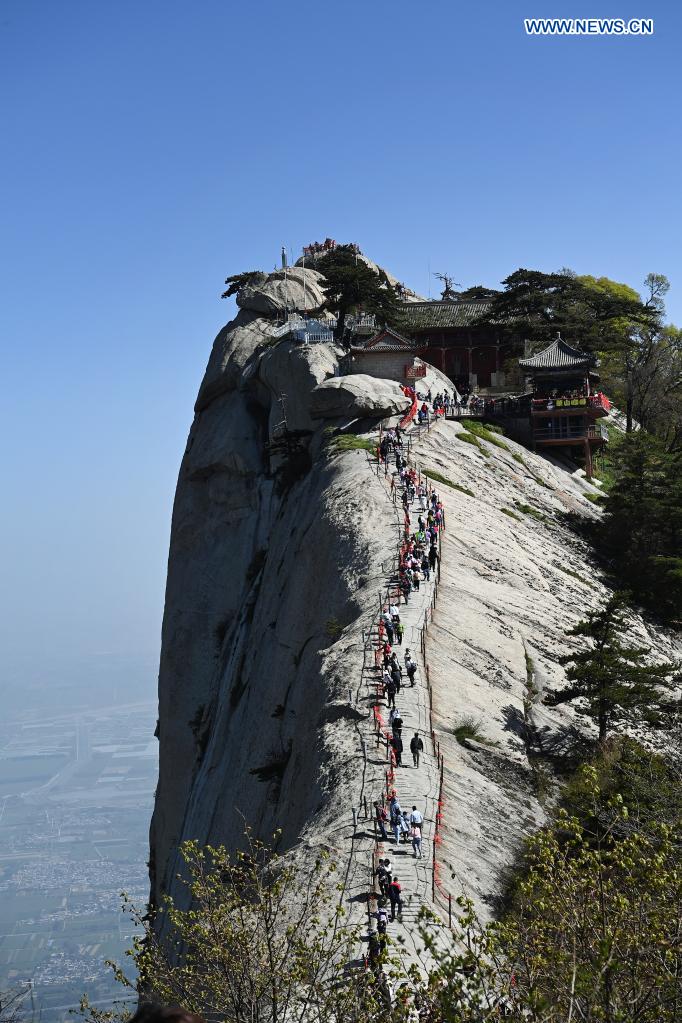 Tourists visit Mount Huashan scenic spot in northwest China's Shaanxi Province, May 5, 2021. During the five-day May Day holiday, the scenic spot received about 110,000 visits as of 4 p.m. Wednesday. (Xinhua/Tao Ming)