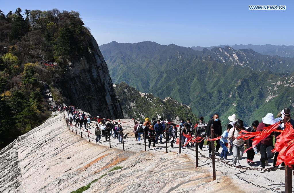 Tourists visit Mount Huashan scenic spot in northwest China's Shaanxi Province, May 5, 2021. During the five-day May Day holiday, the scenic spot received about 110,000 visits as of 4 p.m. Wednesday. (Xinhua/Tao Ming)