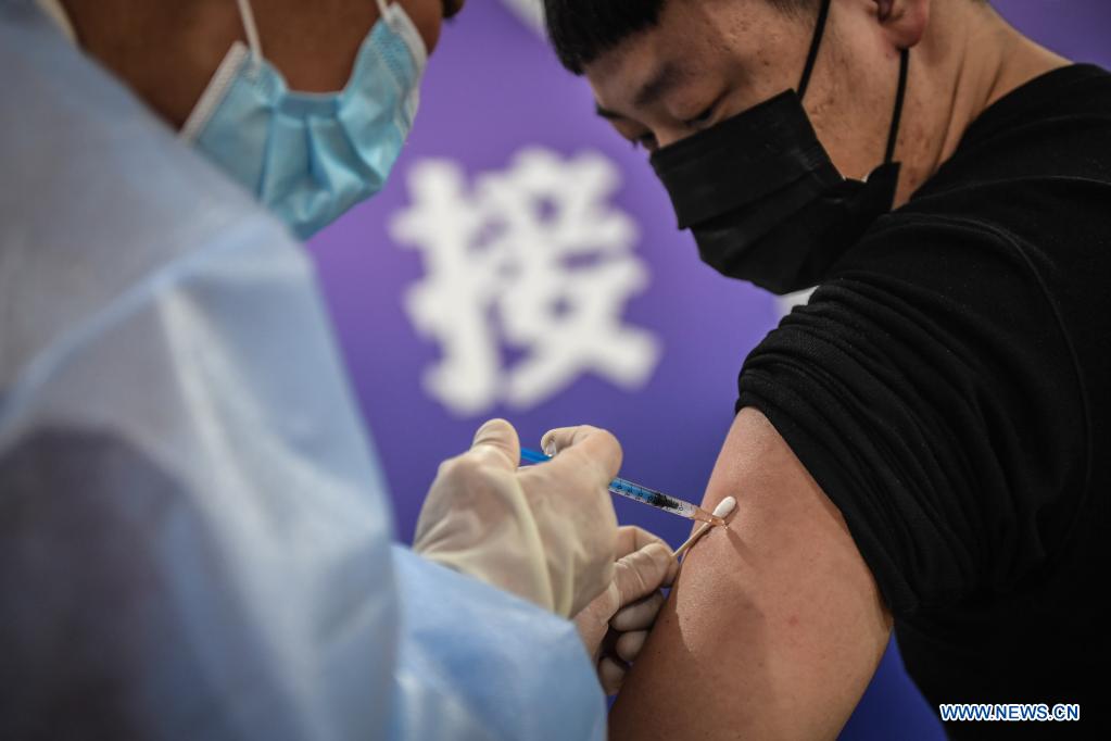 A man receives the COVID-19 vaccine at a vaccination site in Dadong District of Shenyang, northeast China's Liaoning Province, May 7, 2021. The vaccination site, which was transformed from a sports center, went into service on Friday. Covering 4,000 square meters, the site is divided into 8 areas including temperature measuring area, waiting area, registration area, and etc. (Xinhua/Pan Yulong)
