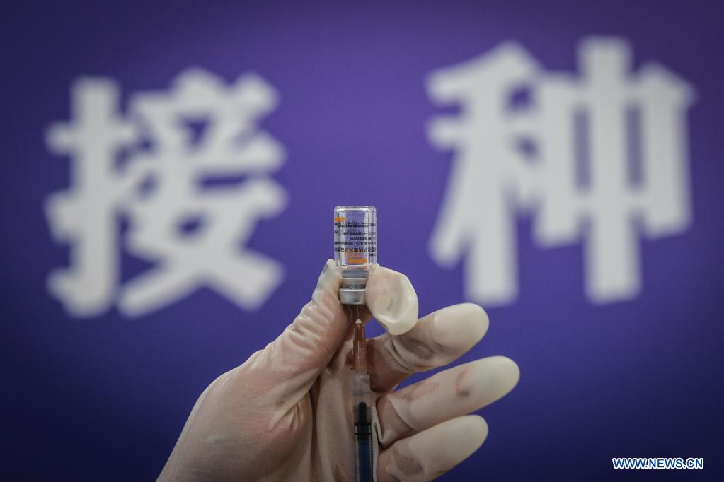 A medical worker prepares a dose of vaccine at a vaccination site in Dadong District of Shenyang, northeast China's Liaoning Province, May 7, 2021. The vaccination site, which was transformed from a sports center, went into service on Friday. Covering 4,000 square meters, the site is divided into 8 areas including temperature measuring area, waiting area, registration area, and etc. (Xinhua/Pan Yulong)