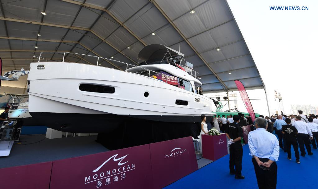 Visitors tour a yacht show during the first China International Consumer Products Expo in Haikou, capital of south China's Hainan Province, May 7, 2021. The yacht show, part of the first China International Consumer Products Expo, opened on Friday at the Haikou National Sailing Base Public Wharf in Haikou, featuring a total of 107 yachts in 58 brands. The expo kicked off here on Thursday. (Xinhua/Yang Guanyu)