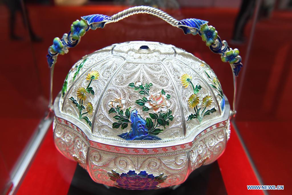 Photo taken on May 10, 2021 shows a piece of craftwork on display during the first China International Consumer Products Expo in Haikou, capital of south China's Hainan Province. Domestic exhibits with Chinese characteristics are quite a sight at the Expo, not only meeting the needs of consumers, but also reflecting the unique charm of Chinese culture. (Xinhua/Yang Guanyu)