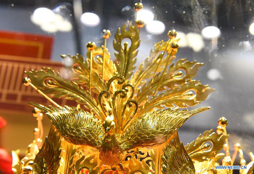 Photo taken on May 10, 2021 shows a piece of gold ornament on display during the first China International Consumer Products Expo in Haikou, capital of south China's Hainan Province. Domestic exhibits with Chinese characteristics are quite a sight at the Expo, not only meeting the needs of consumers, but also reflecting the unique charm of Chinese culture. (Xinhua/Yang Guanyu)