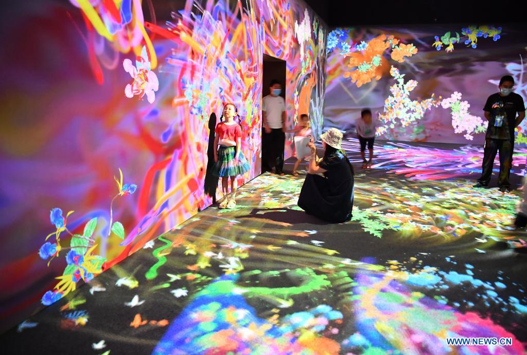 People visit the teamLab Future Park during an art festival themed on science and technology in Xi'an, northwest China's Shaanxi Province, June 6, 2021. (Xinhua/Shao Rui)