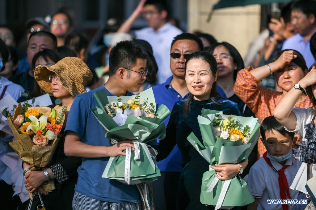  Parents wait outside an exam site at a high school in Hohhot, north China's Inner Mongolia Autonomous Region, June 8, 2021. China's annual college entrance exam concluded on Tuesday in some parts of the country. Considered the world's most grueling test, the exam, better known as the Gaokao, saw a record 10.78 million candidates signing up this year. (Xinhua/Bei He)