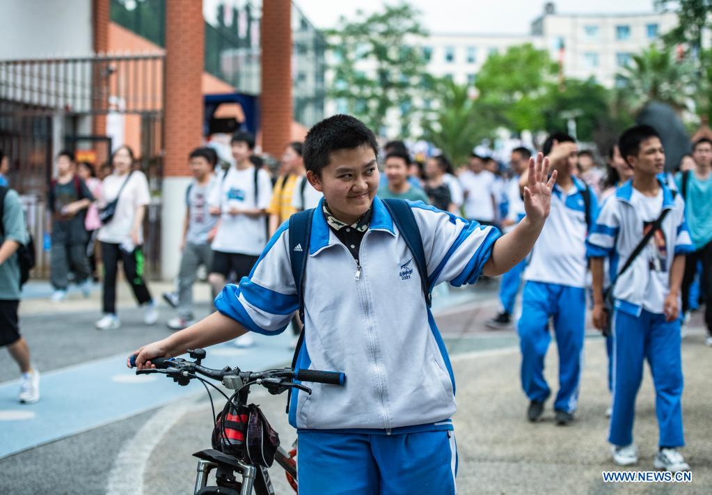 Examinees walk out of an exam site at a high school in Guiyang, the capital city of southwest China's Guizhou Province, June 8, 2021. China's annual college entrance exam concluded on Tuesday in some parts of the country. Considered the world's most grueling test, the exam, better known as the Gaokao, saw a record 10.78 million candidates signing up this year. (Xinhua/Tao Liang)