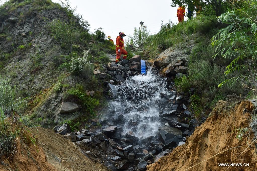 Water is drained from the accident site of an iron mine flooding in Daixian County, north China's Shanxi Province, June 11, 2021. Thirteen people were trapped in an iron mine flooding in north China's Shanxi Province, local authorities said Thursday. The rescue work is underway. (Xinhua/Chai Ting)