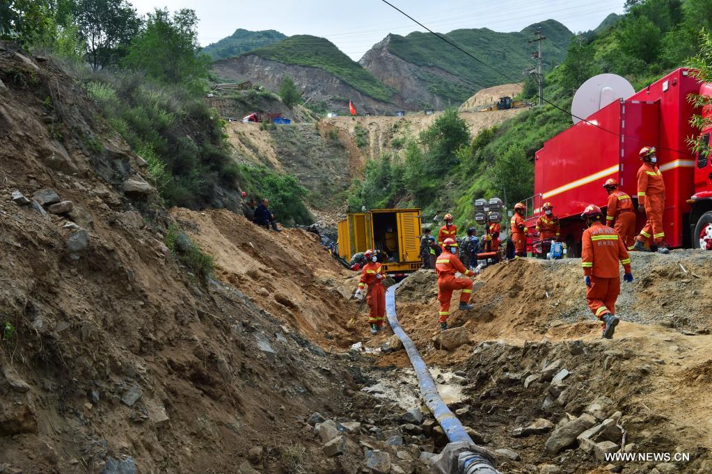 Rescuers work at the accident site of an iron mine flooding in Daixian County, north China's Shanxi Province, June 11, 2021. Thirteen people were trapped in an iron mine flooding in north China's Shanxi Province, local authorities said Thursday. The rescue work is underway. (Xinhua/Chai Ting)