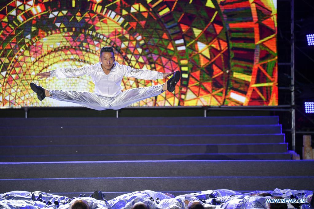 An artist dances at a culture and tourism event in Hohhot, north China's Inner Mongolia Autonomous Region, June 10, 2021. Various activities such as appreciating traditional music and tasting local food are held here to promote tourism. (Xinhua/Bei He)