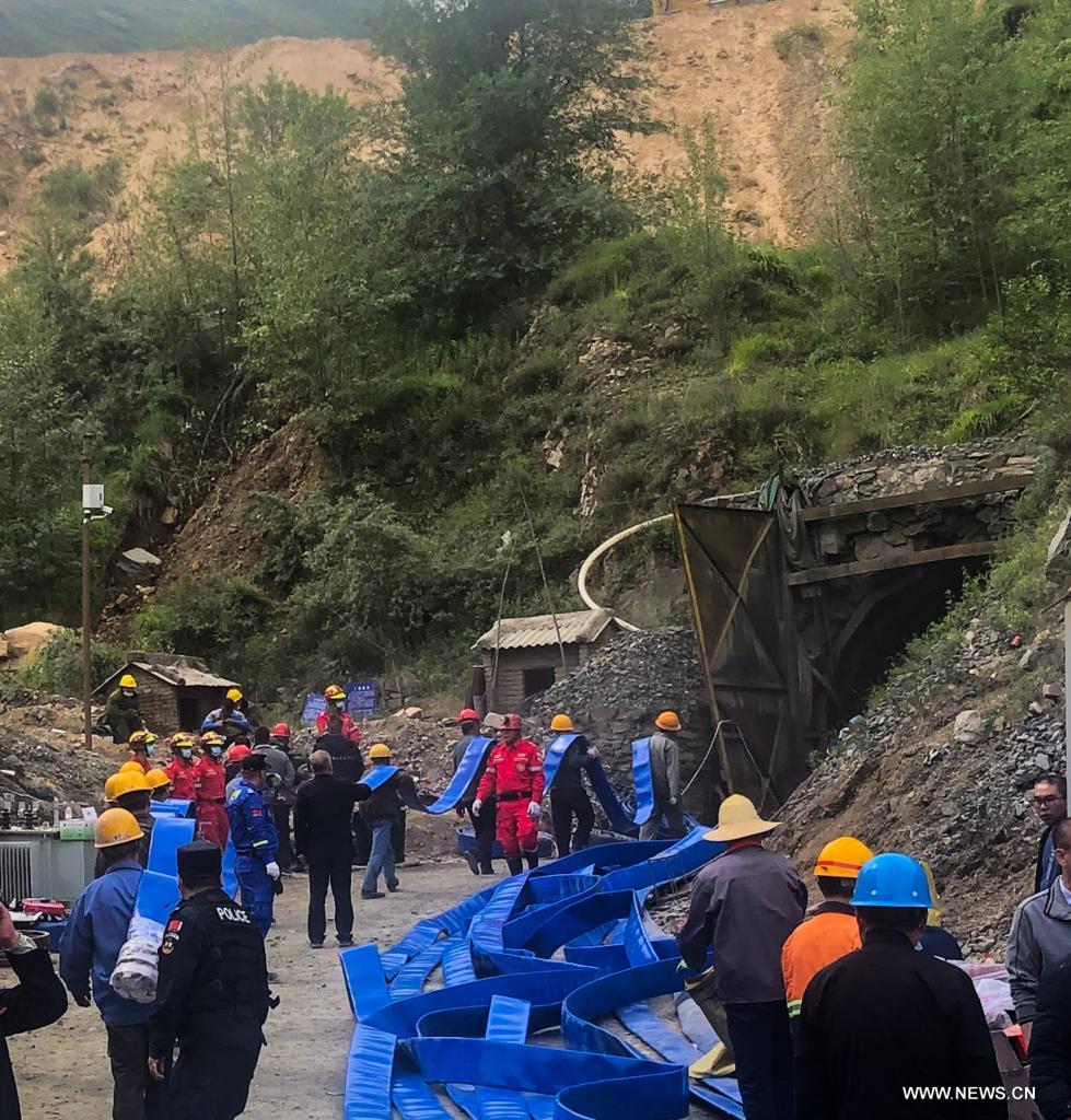 Rescuers work at the accident site of an iron mine flooding in Daixian County, north China's Shanxi Province, June 11, 2021. Thirteen people were trapped in an iron mine flooding in north China's Shanxi Province, local authorities said Thursday. The rescue work is underway. (Xinhua/Chai Ting)