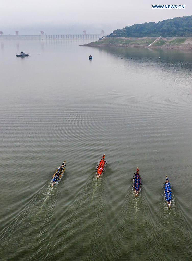 Aerial photo taken on June 14, 2021 shows people participating in a dragon boat race to celebrate the Dragon Boat Festival in Zigui County, central China's Hubei Province. China celebrated the Dragon Boat Festival on Monday to commemorate Qu Yuan, a patriotic poet from the Warring States Period (475-221 BC) believed to have been born in Zigui County. (Photo by Zheng Jiayu/Xinhua)