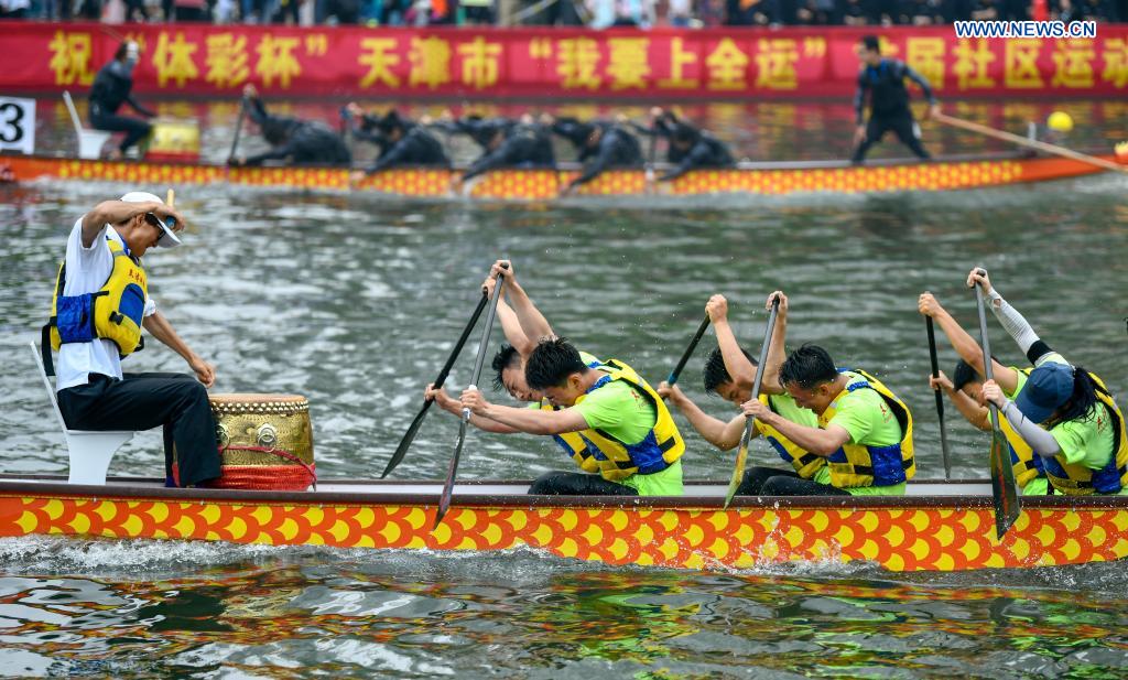 People participate in a dragon boat race to celebrate the Dragon Boat Festival in Tianjin, north China, June 14, 2021. China celebrated the Dragon Boat Festival on Monday to commemorate Qu Yuan, a patriotic poet from the Warring States Period (475-221 BC). (Photo by Sun Fanyue/Xinhua)