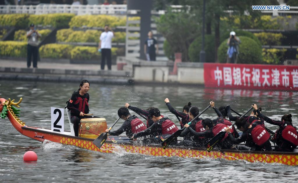 People participate in a dragon boat race to celebrate the Dragon Boat Festival in Tianjin, north China, June 14, 2021. China celebrated the Dragon Boat Festival on Monday to commemorate Qu Yuan, a patriotic poet from the Warring States Period (475-221 BC). (Xinhua/Zhao Zishuo)