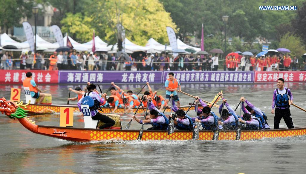 People participate in a dragon boat race to celebrate the Dragon Boat Festival in Tianjin, north China, June 14, 2021. China celebrated the Dragon Boat Festival on Monday to commemorate Qu Yuan, a patriotic poet from the Warring States Period (475-221 BC). (Xinhua/Zhao Zishuo)