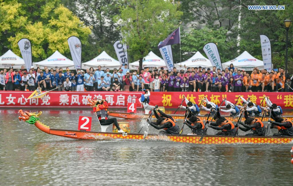 People participate in a dragon boat race to celebrate the Dragon Boat Festival in Tianjin, north China, June 14, 2021. China celebrated the Dragon Boat Festival on Monday to commemorate Qu Yuan, a patriotic poet from the Warring States Period (475-221 BC). (Photo by Sun Fanyue/Xinhua)