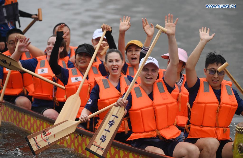 Participants celebrate after a dragon boat race to celebrate the Dragon Boat Festival in Tianjin, north China, June 14, 2021. China celebrated the Dragon Boat Festival on Monday to commemorate Qu Yuan, a patriotic poet from the Warring States Period (475-221 BC). (Xinhua/Zhao Zishuo)