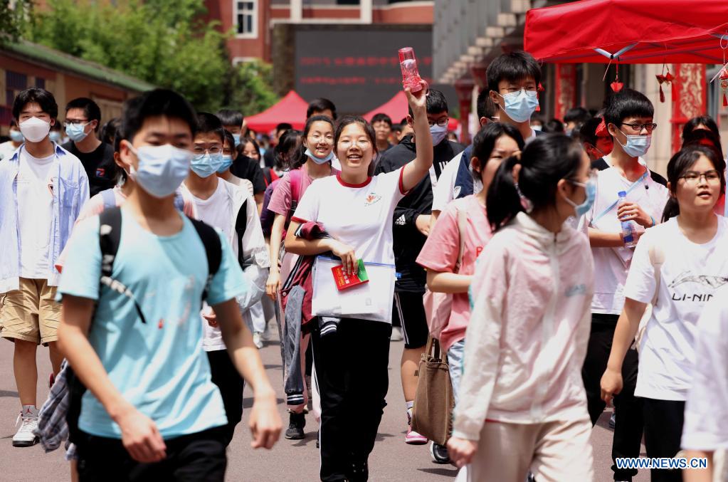 Examinees walk out of an exam site of the 2021 senior high school entrance examination in Hefei, capital of east China's Anhui Province, June 14, 2021. The 2021 senior high school entrance examination in Hefei kicked off on Monday. (Photo by Xie Chen/Xinhua)