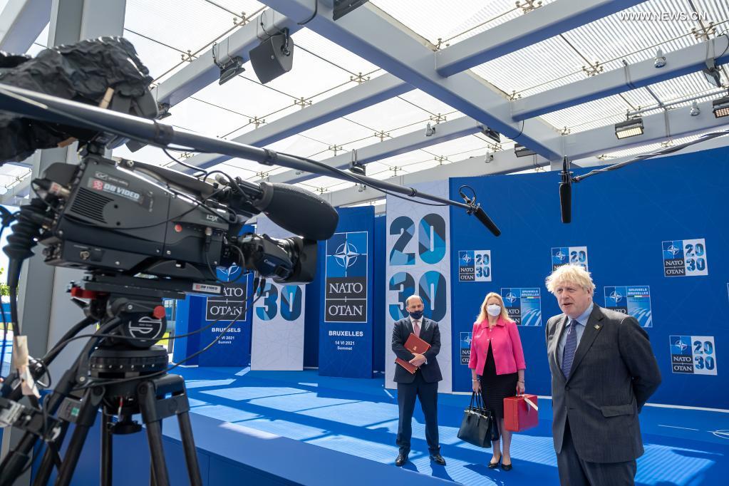 British Prime Minister Boris Johnson (R) arrives for a NATO summit at NATO headquarters in Brussels, Belgium, on June 14, 2021. Leaders of the North Atlantic Treaty Organization (NATO) held a face-to-face summit on Monday to show their unity and agreed on the 