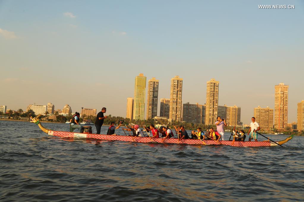 Paddlers from Dragon Boat Egypt Academy compete during a dragon boat race on the Nile in Cairo, Egypt, on June 14, 2021. The dragon boat race was held here on Monday to celebrate the traditional Chinese Dragon Boat Festival. (Xinhua/Sui Xiankai)