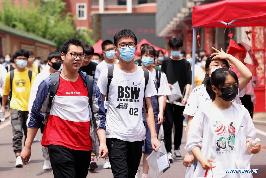 Examinees walk out of an exam site of the 2021 senior high school entrance examination in Hefei, capital of east China's Anhui Province, June 14, 2021. The 2021 senior high school entrance examination in Hefei kicked off on Monday. (Photo by Xie Chen/Xinhua)