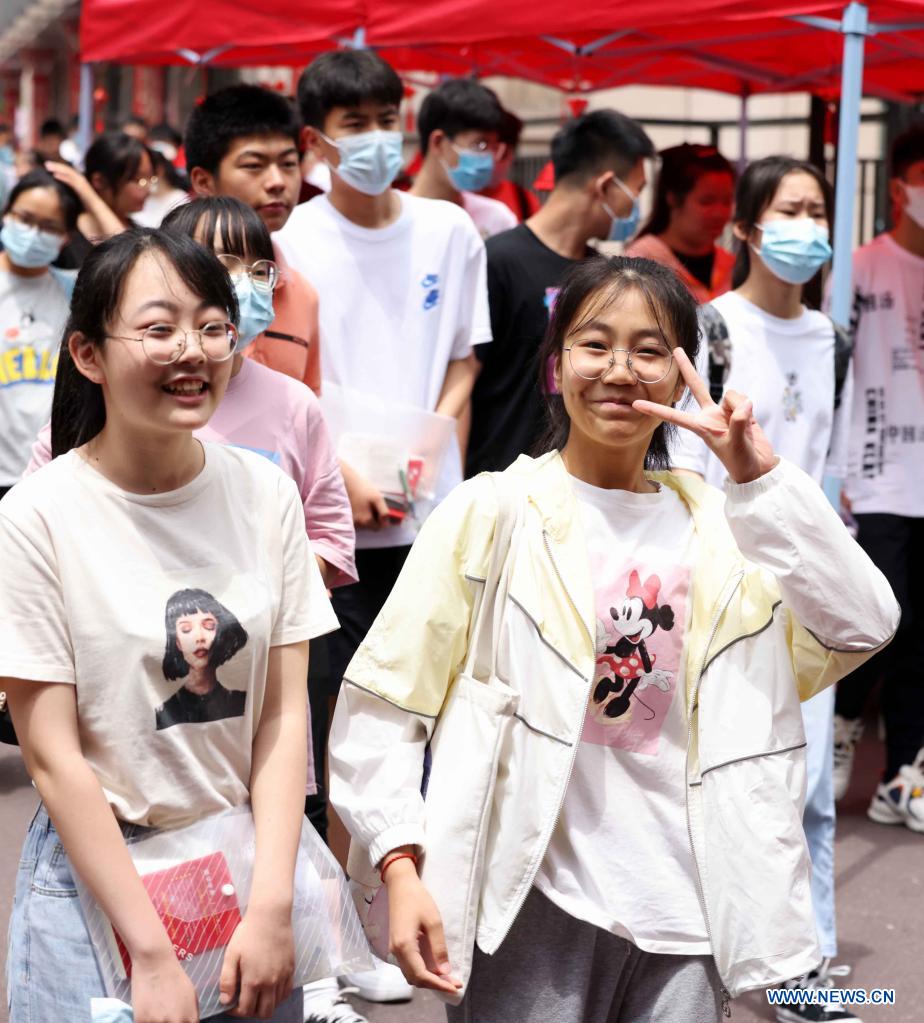 Examinees walk out of an exam site of the 2021 senior high school entrance examination in Hefei, capital of east China's Anhui Province, June 14, 2021. The 2021 senior high school entrance examination in Hefei kicked off on Monday. (Photo by Xie Chen/Xinhua)