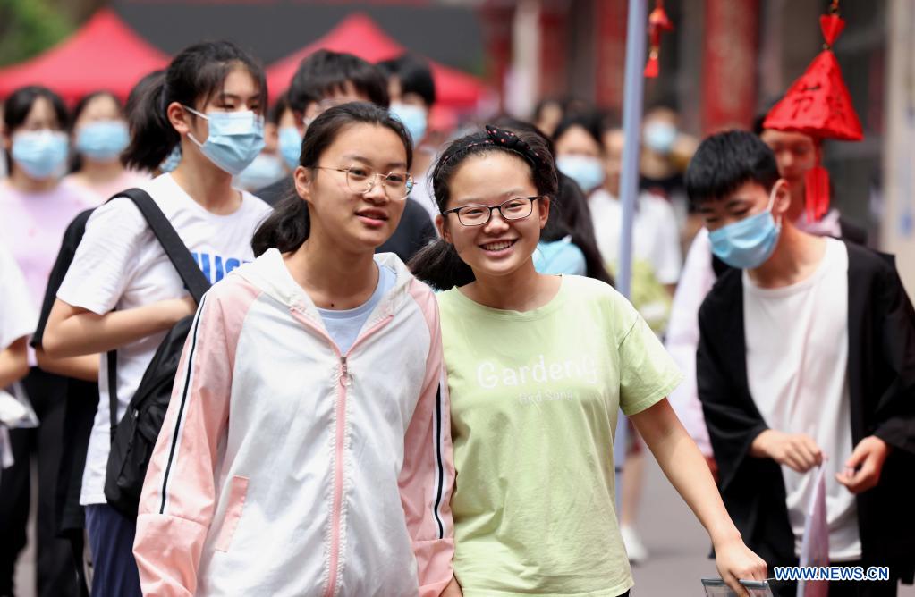 Examinees walk out of an exam site of the 2021 senior high school entrance examination in Hefei, capital of east China's Anhui Province, June 14, 2021. The 2021 senior high school entrance examination in Hefei kicked off on Monday. (Photo by Xie Chen/Xinhua)