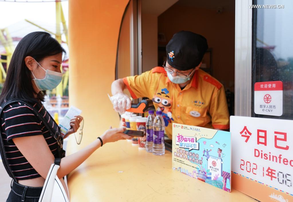 A tourist pays with digital RMB at the Happy Valley Beijing theme park the in Beijing, capital of China, June 16, 2021. (Xinhua/Chen Zhonghao)