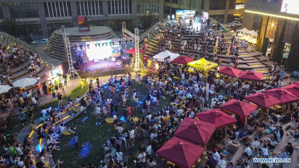 Aerial photo taken on July 10, 2021 shows the venue of a drinking carnival in Xiqing District of north China's Tianjin. A drinking carnival called 