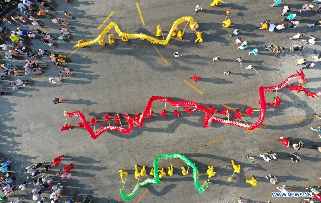 Aerial photo shows dragon dance teams performing during 