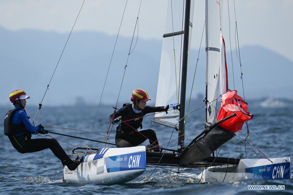 Chinese sailors of the Nacra 17 Mixed class Hu Xiaoxiao (R) and Yang Xuezhe attend a training session at Enoshima Yacht Harbour, in Kanagawa, Japan, on July 20, 2021. (Xinhua/Huang Zongzhi)