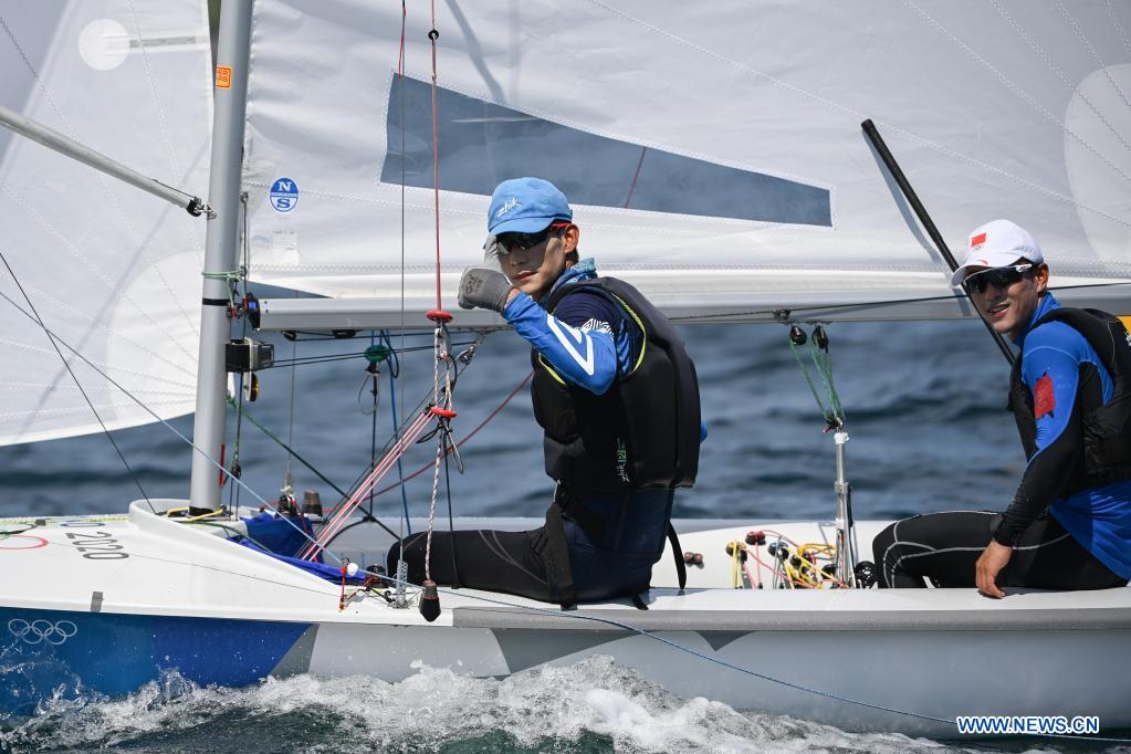 Chinese sailors of men's 470 class Wang Yang (L) and Xu Zangjun react during a training session at Enoshima Yacht Harbour, in Kanagawa, Japan, on July 20, 2021. (Xinhua/Huang Zongzhi)