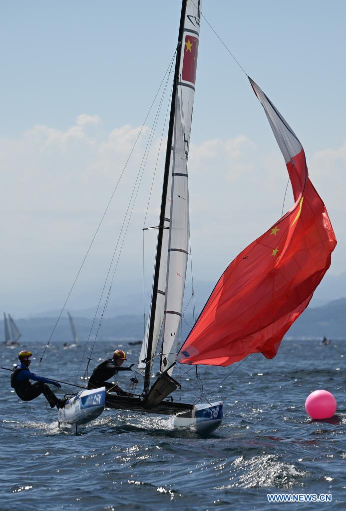 Chinese sailors of the Nacra 17 Mixed class Hu Xiaoxiao(R) and Yang Xuezhe attend a training session at Enoshima Yacht Harbour, in Kanagawa, Japan, on July 20, 2021. (Xinhua/Huang Zongzhi)