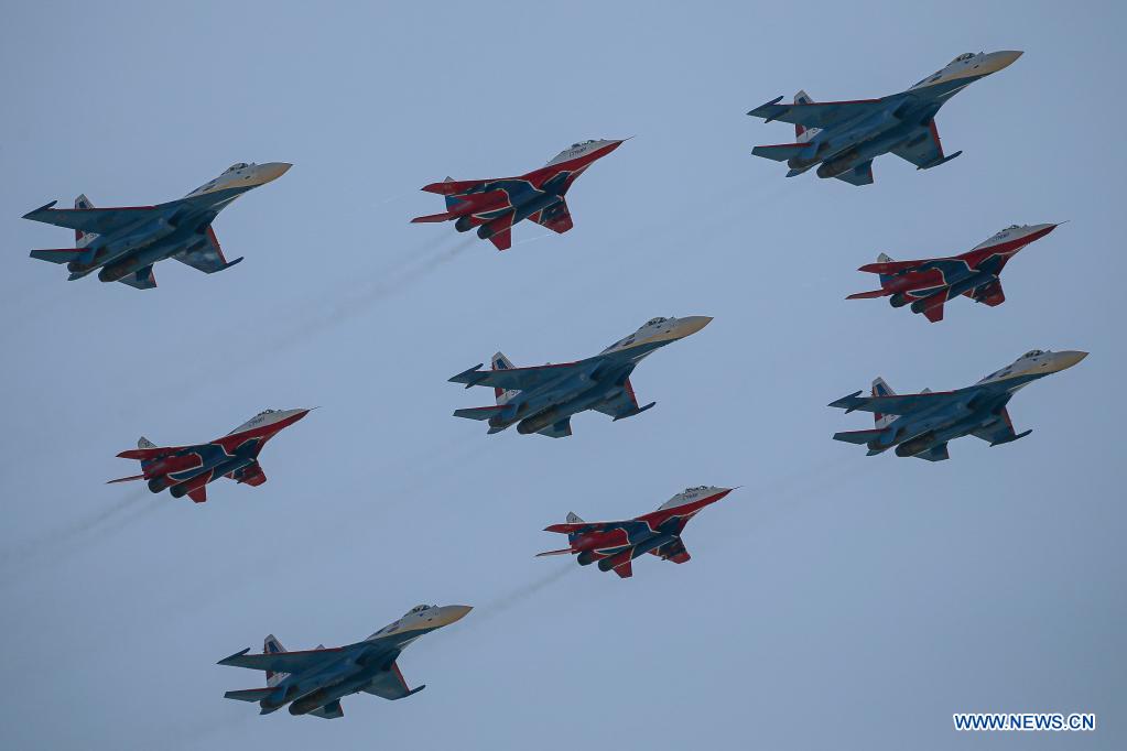 The Swifts and the Russian Knights aerobatic demonstration teams perform during the opening day of the International Aviation and Space Salon (MAKS)-2021 in a Moscow suburb, Russia, on July 20, 2021. MAKS-2021 kicked off in a Moscow suburb on Tuesday. (Xinhua/Evgeny Sinitsyn)