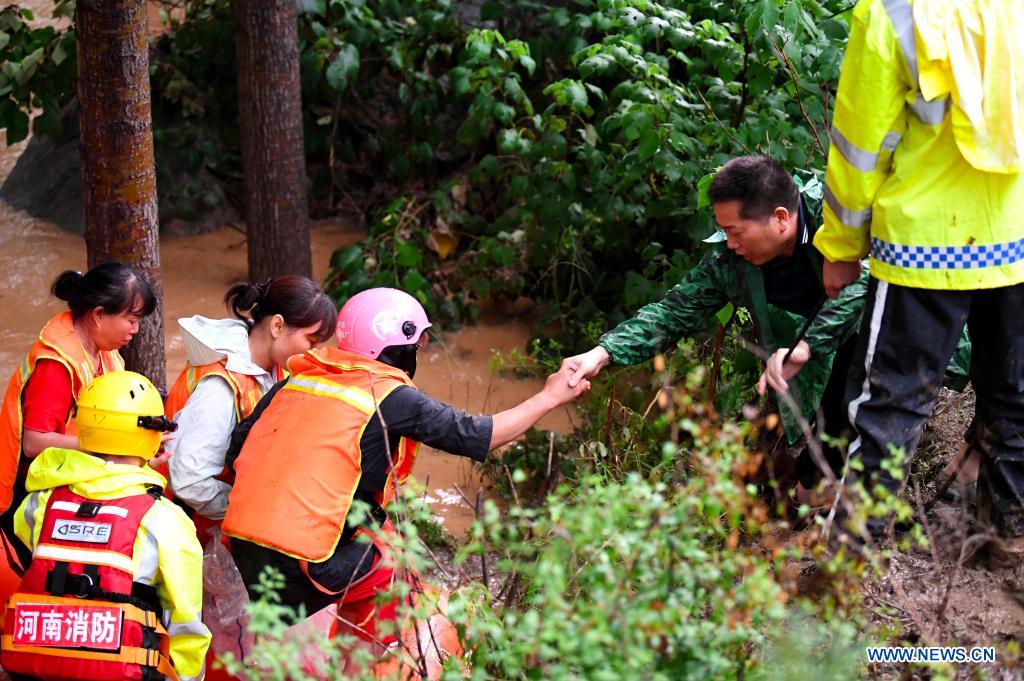 Rescuers transfer stranded villagers in Longtou Village, Dengfeng City of central China's Henan Province, July 20, 2021. Longtou Village was hit by mountain torrents on Tuesday. Rescuers have transferred over 50 villagers to safer places. (Xinhua/Hao Yuan)