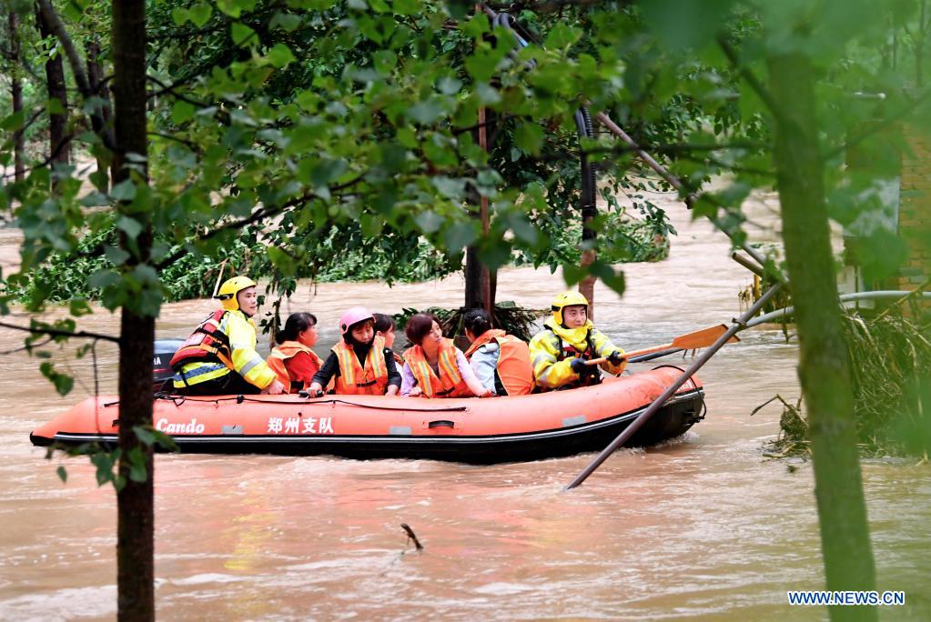 Rescuers transfer stranded villagers in Longtou Village, Dengfeng City of central China's Henan Province, July 20, 2021. Longtou Village was hit by mountain torrents on Tuesday. Rescuers have transferred over 50 villagers to safer places. (Xinhua/Hao Yuan)