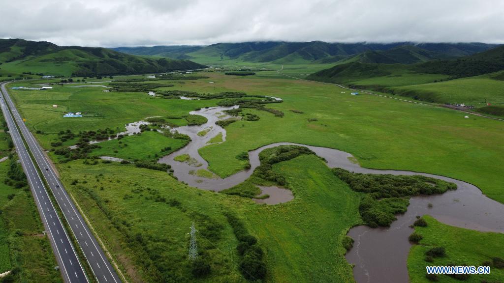 Aerial photo taken on July 26, 2021 shows a river flowing through the Wulanmaodu pasture, which is located in the northern part of Horqin Right Wing Front Banner, Hinggan League, north China's Inner Mongolia Autonomous Region. (Xinhua/Bei He)