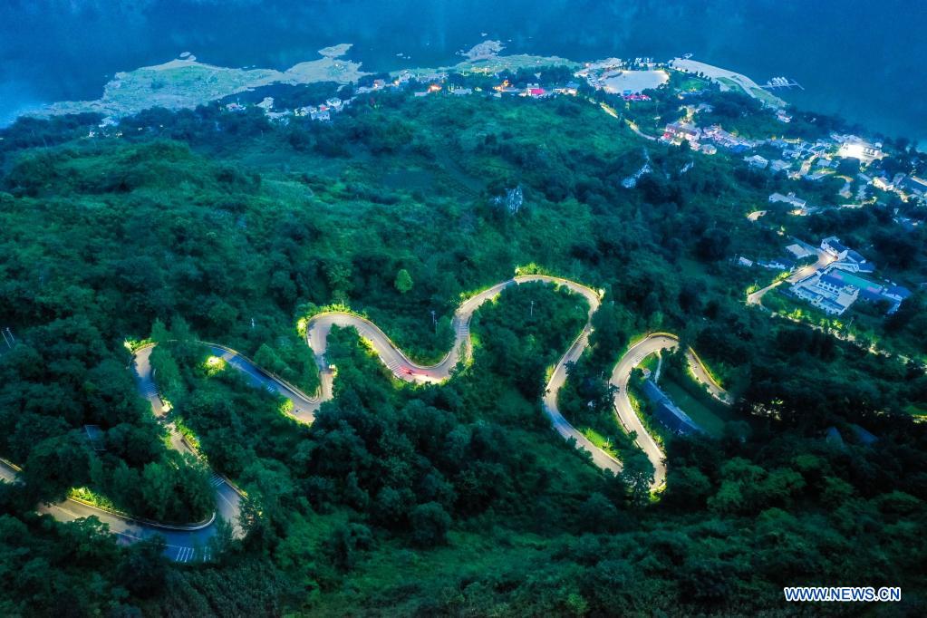 Aerial photo taken on July 23, 2021 shows a road leading to Huawu Village in Xinren Miao Township, Qianxi City, southwest China's Guizhou Province. Huawu Village, although boasting unique ethnic Miao culture and splendid mountain views with vast water bodies, once had a poverty headcount ratio as high as 63.6 percent. Taking advantage of the rich cultural and natural heritage, the local government initiated a scenic area project as a targeted measure to shake off poverty to boost tourism by constructing a 