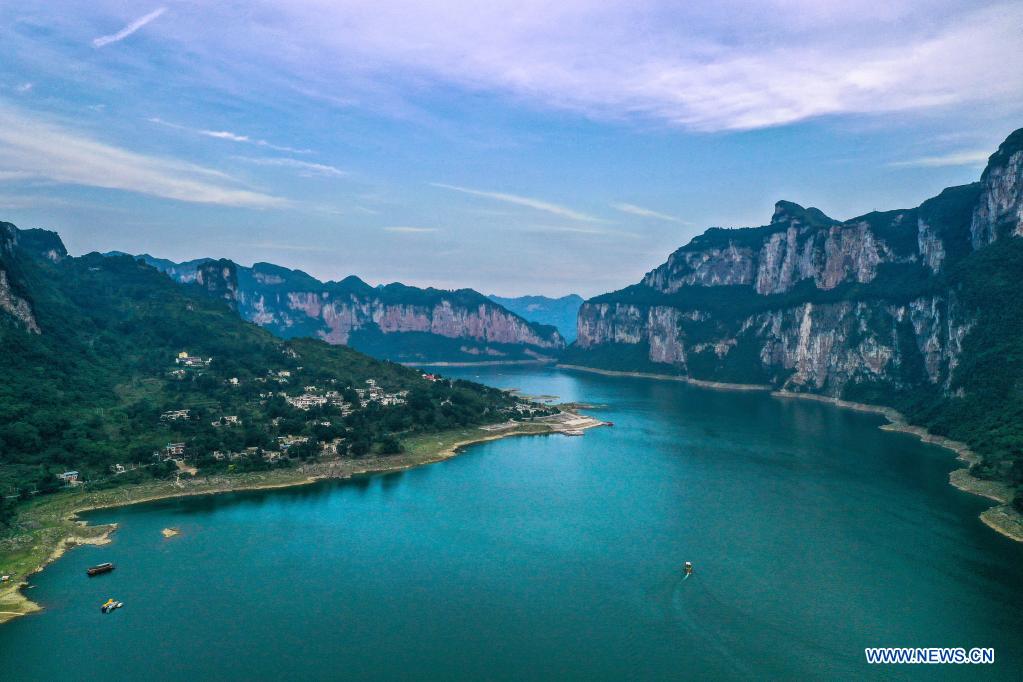 Aerial photo taken on July 24, 2021 shows a dusk view of Huawu Village in Xinren Miao Township, Qianxi City, southwest China's Guizhou Province. Huawu Village, although boasting unique ethnic Miao culture and splendid mountain views with vast water bodies, once had a poverty headcount ratio as high as 63.6 percent. Taking advantage of the rich cultural and natural heritage, the local government initiated a scenic area project as a targeted measure to shake off poverty to boost tourism by constructing a 