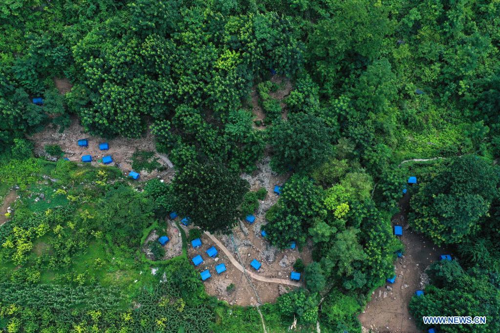 Aerial photo taken on July 24, 2021 shows a view of a forest chicken farm at Huawu Village in Xinren Miao Township, Qianxi City, southwest China's Guizhou Province. Huawu Village, although boasting unique ethnic Miao culture and splendid mountain views with vast water bodies, once had a poverty headcount ratio as high as 63.6 percent. Taking advantage of the rich cultural and natural heritage, the local government initiated a scenic area project as a targeted measure to shake off poverty to boost tourism by constructing a 