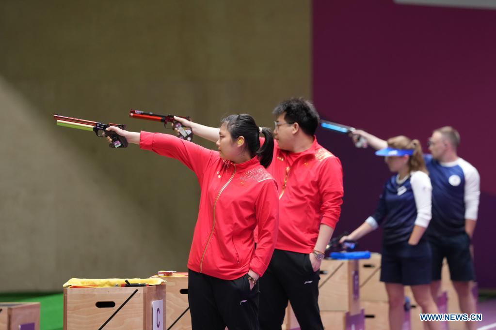 Pang Wei (2nd L) and Jiang Ranxin (1st L) of China compete during the 10m air pistol mixed team final at the Tokyo 2020 Olympic Games in Tokyo, Japan, July 27, 2021. (Xinhua/Ju Huanzong)