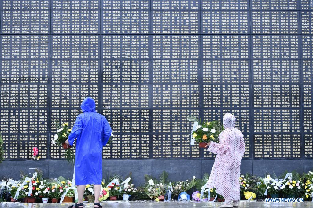 People mourn for victims in the 1976 Tangshan earthquake at the Tangshan Earthquake Memorial Park in north China's Hebei Province, July 27, 2021. Wednesday marks the 45th anniversary of the Tangshan earthquake. The 7.8-magnitude quake struck the city of Tangshan in Hebei Province on July 28, 1976, killing more than 240,000 people and destroying virtually all buildings. (Xinhua/Mu Yu)