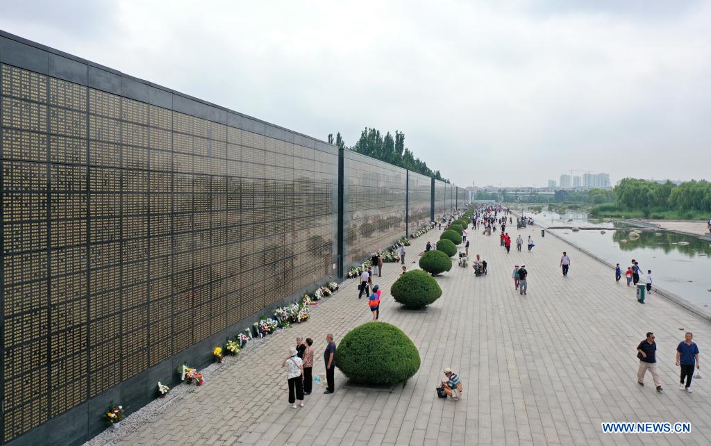 Aerial photo taken on July 28, 2021 shows people mourning for victims in the 1976 Tangshan earthquake at the Tangshan Earthquake Memorial Park in Tangshan, north China's Hebei Province. Wednesday marks the 45th anniversary of the Tangshan earthquake. The 7.8-magnitude quake struck the city of Tangshan in Hebei Province on July 28, 1976, killing more than 240,000 people and destroying virtually all buildings. (Xinhua/Mu Yu)