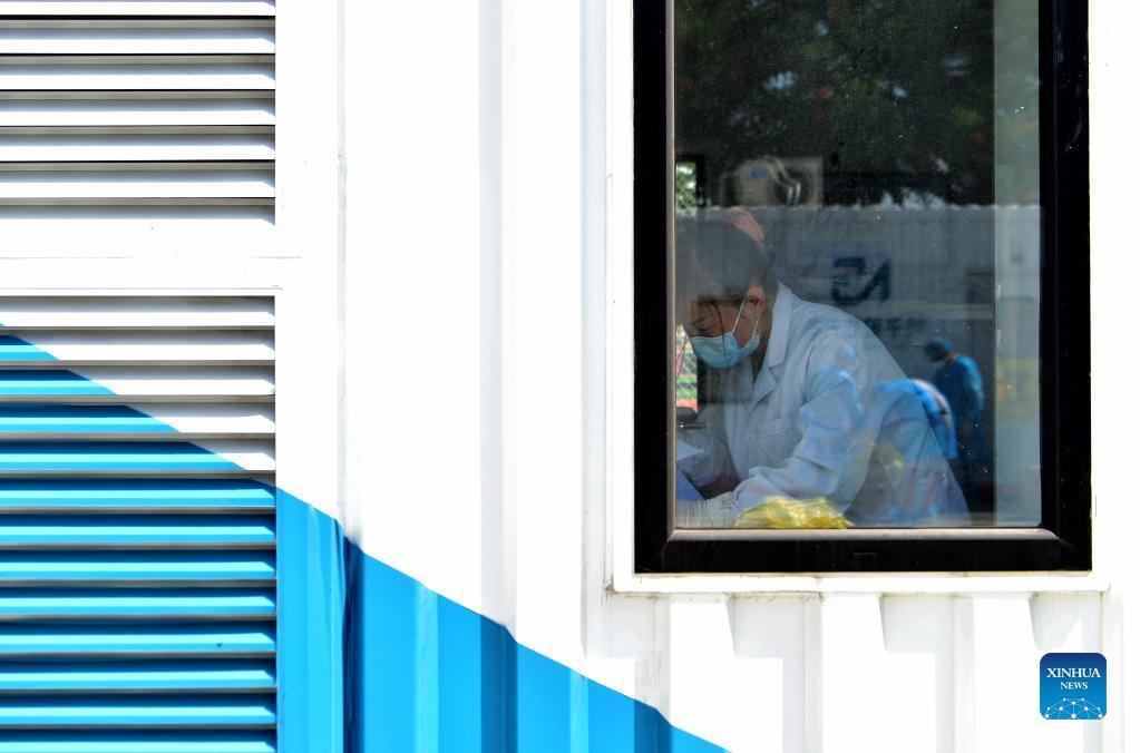 A staff member works in a PCR (polymerase chain reaction) lab for nucleic acid testing in Xianyou County, southeast China's Fujian Province, Sept. 14, 2021. Three PCR labs have been built in the county to boost nucleic acid detection capacity. (Xinhua/Wei Peiquan)