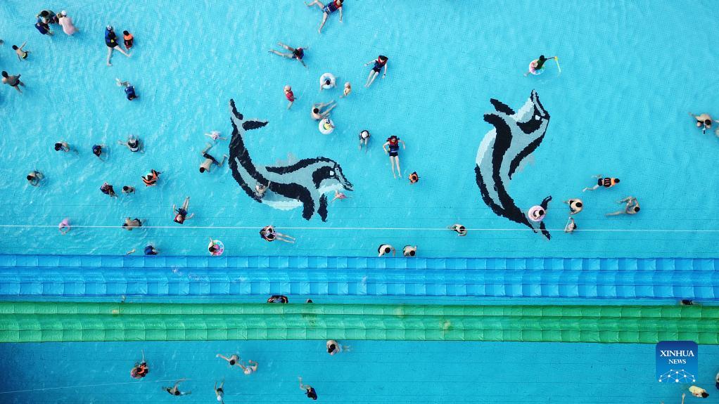 Aerial photo taken on Oct. 2, 2021 shows tourists enjoying themselves at a water park in Changsha, capital of central China's Hunan Province. Saturday was the second day of China's week-long National Day holiday. (Xinhua/Chen Zhenhai)