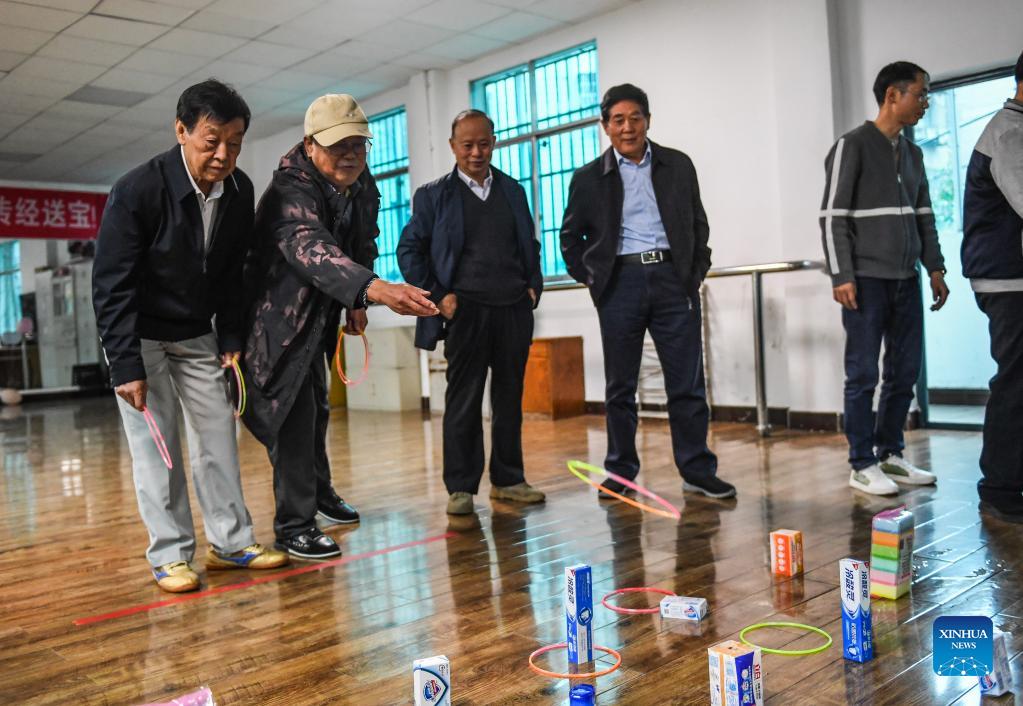 Elders play a game at a university for senior citizens of Zhongshan District in Liupanshui, southwest China's Guizhou Province, Oct. 14, 2021. Various activities are carried out in the district to celebrate the Double Ninth Festival or the Chongyang Festival for the elders. The festival, celebrated throughout China on the ninth day of the ninth month on the Chinese lunar calendar, is an occasion to care for and send blessings to the elderly. (Xinhua/Tao Liang)