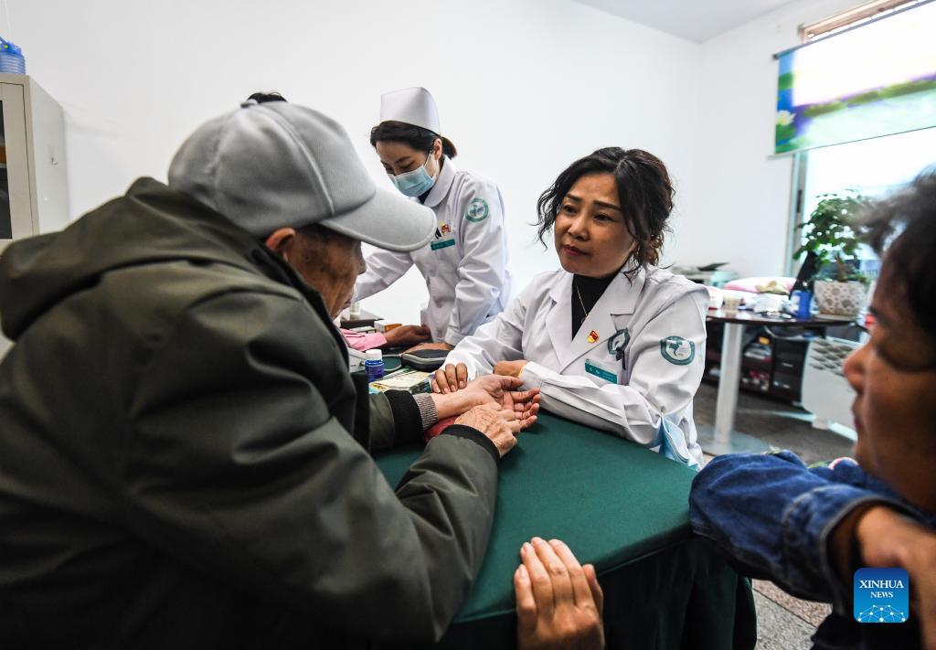 Medical workers provide free medical care service to the elders at a university for senior citizens of Zhongshan District in Liupanshui, southwest China's Guizhou Province, Oct. 14, 2021. Various activities are carried out in the district to celebrate the Double Ninth Festival or the Chongyang Festival for the elders. The festival, celebrated throughout China on the ninth day of the ninth month on the Chinese lunar calendar, is an occasion to care for and send blessings to the elderly. (Xinhua/Tao Liang)