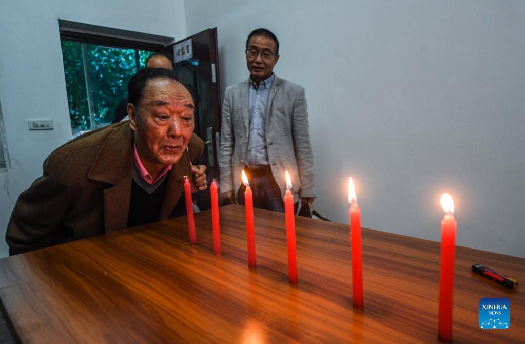 An elder plays a game at a university for senior citizens of Zhongshan District in Liupanshui, southwest China's Guizhou Province, Oct. 14, 2021. Various activities are carried out in the district to celebrate the Double Ninth Festival or the Chongyang Festival for the elders. The festival, celebrated throughout China on the ninth day of the ninth month on the Chinese lunar calendar, is an occasion to care for and send blessings to the elderly. (Xinhua/Tao Liang)